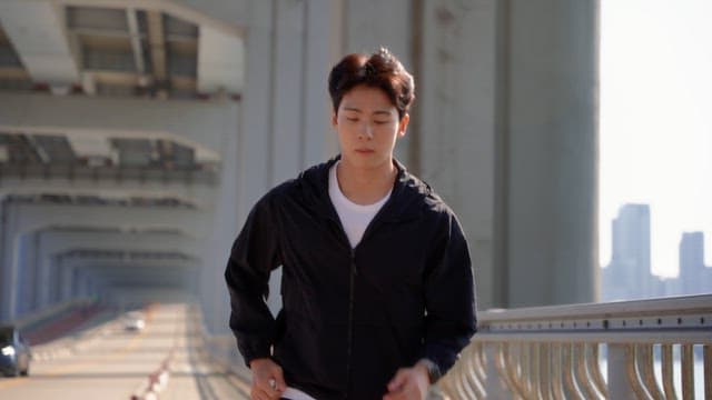 Man jogging on a jamsu bridge