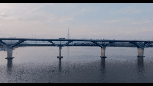 Bridge over river with subway and cars