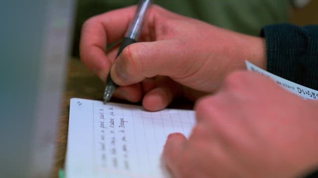 Hand Writing in Notebook