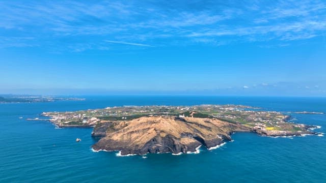 Scenic island surrounded by blue sea