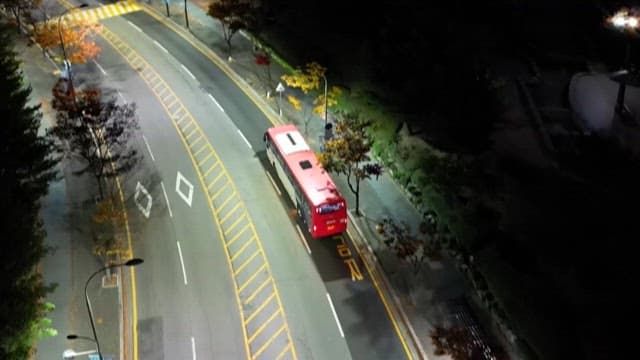 Bus Passing by on a Quiet Road at Night