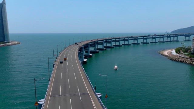 Busan cityscape with modern high-rise buildings, Gwangan Bridge, and the ocean