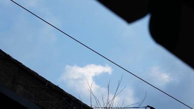Blue Sky with Flowing Clouds
