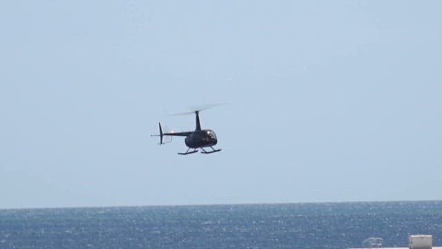 Helicopter landing on a floating platform in the sea