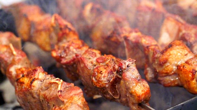 Juicy mutton sashlik grilling over charcoal