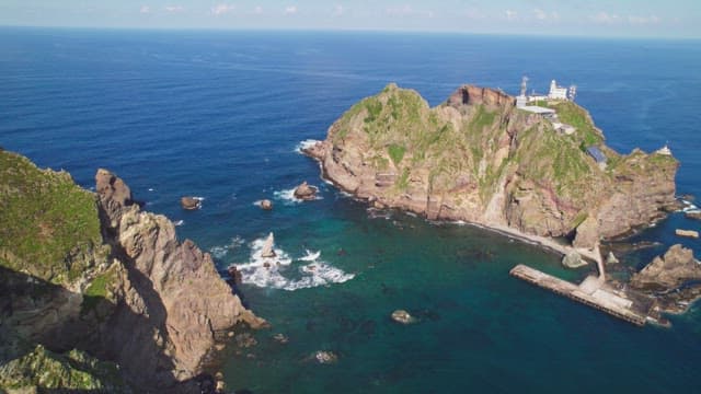 Rocky island surrounded by blue ocean