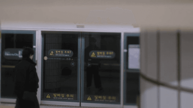 Person waiting for the subway at a station