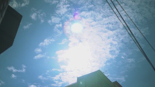 Sunny sky with clouds over the building