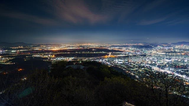 Cityscape at Night from a Mountain Viewpoint