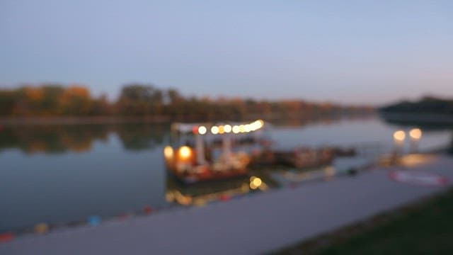 Floating restaurant by the river at dusk