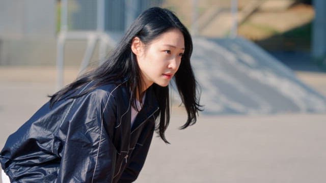 Woman preparing to run on a sunny day
