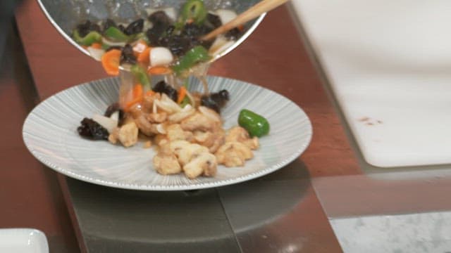 Sauce poured over deep-fried mushrooms on a plate