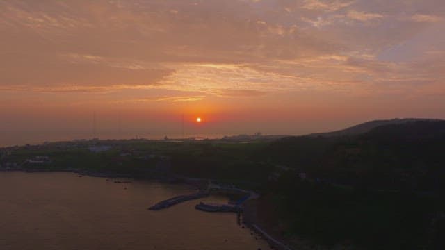 Serene coastal landscape at sunset