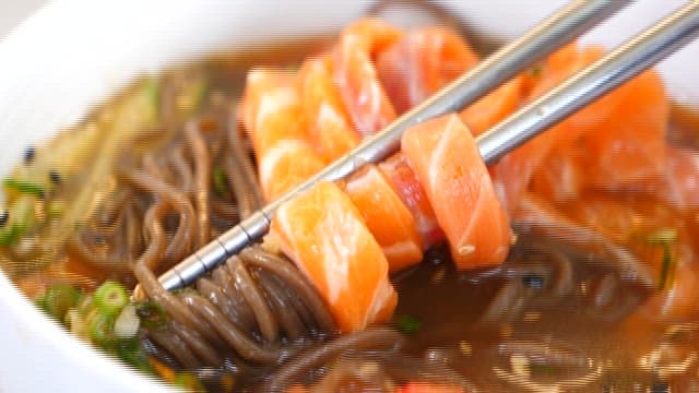 Appetizing salmon and buckwheat noodles in a bowl