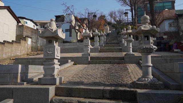 Traditional stone lanterns lining a staircase