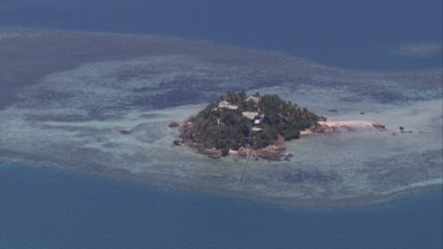 Tropical island surrounded by the sea