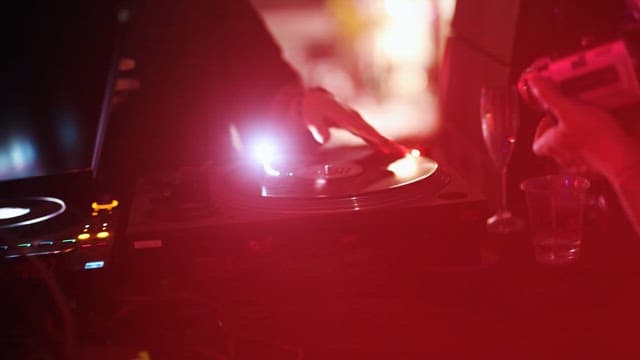 DJ Interacting with the Audience at the Club