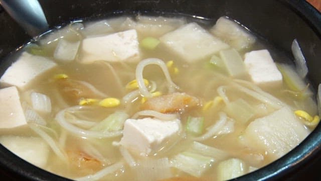 Scene where dried pollack hangover soup is scooped up with a spoon