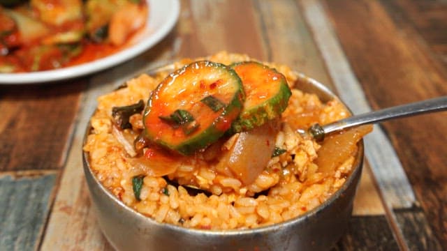 Seasoned cucumber served with rice in kimchi stew