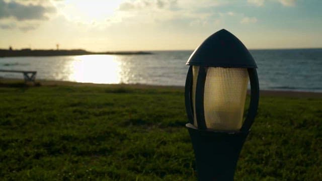 Serene Seascape with a Prominent Lamp Post