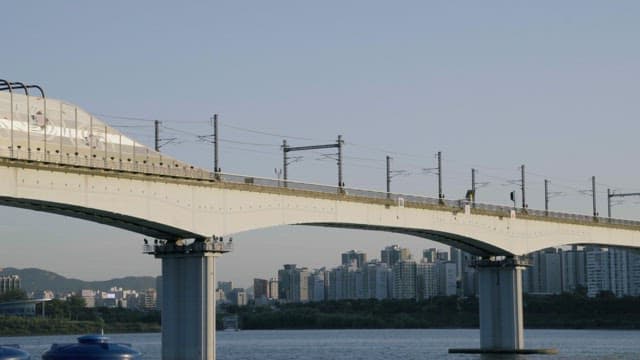 Subway Crossing Railway Bridge with City Buildings
