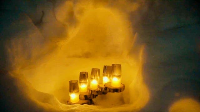 Candles Illuminating a Snowy Nook
