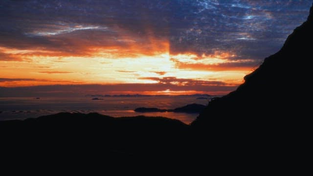 Vibrant sunset over the mountains and ocean