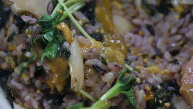 Flavorful mixed rice bowl with vegetables and seafood