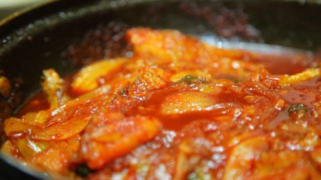 Spicy braised half-dried pollack simmering in a pot