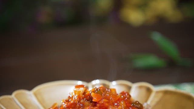 Fried mushroom dish with spicy sauce served on a plate