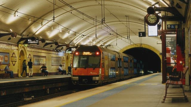 Train arriving at a bustling city station
