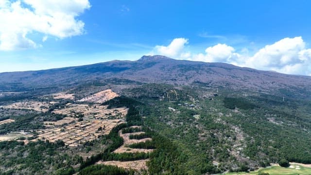 Vast mountain landscape with fields
