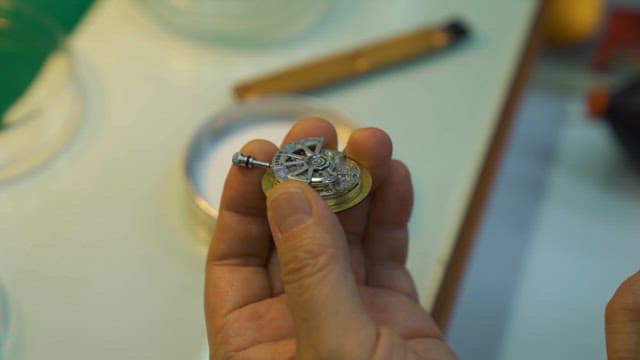Expert Craftsman Repairing Intricate Watch Parts