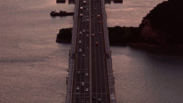 Cars driving on a bridge over water