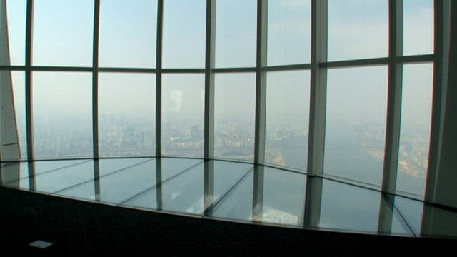 Cityscape view through high-rise building windows