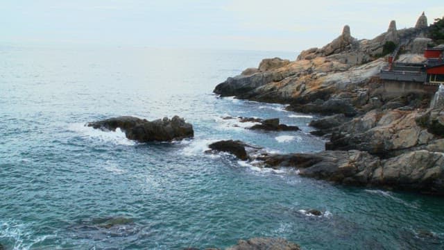 Haedong Yonggungsa Temple, a popular tourist destination located on a coastal rock cliff