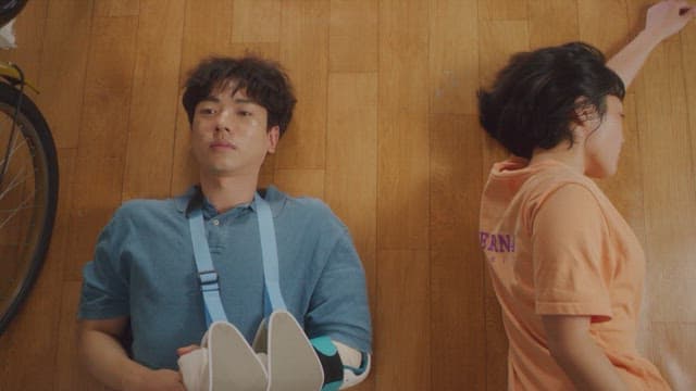 Man and a woman lying on the floor and talking