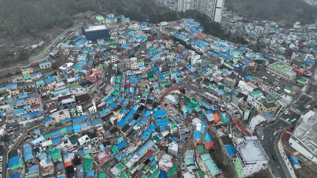 Colorful hillside village with winding roads