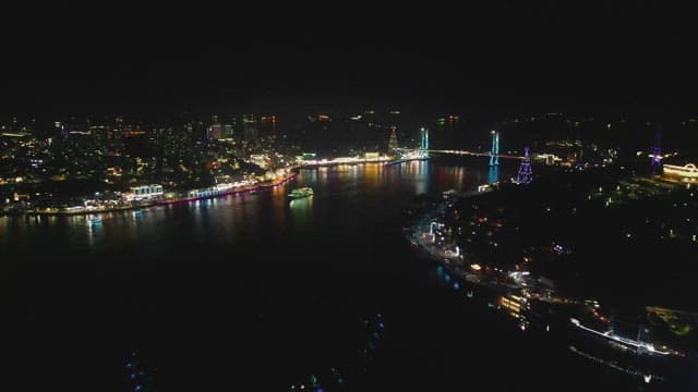 Vibrant cityscape with illuminated bridges