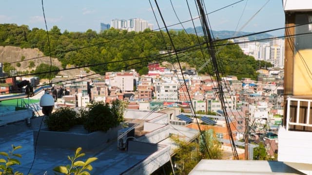 Cityscape with hills in the background on a sunny day