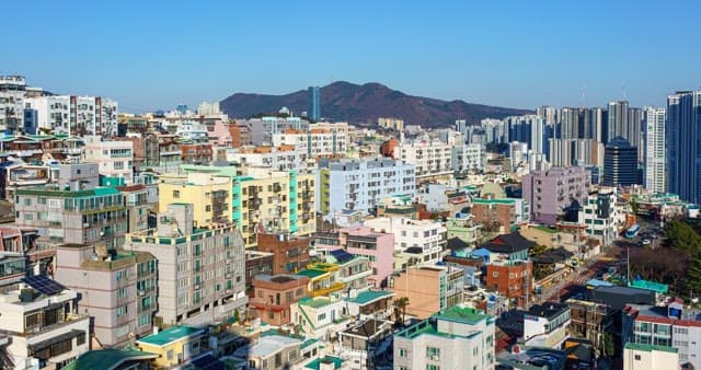 City filled with buildings from day to night