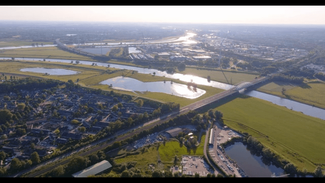 Aerial view of a village with rivers and fields