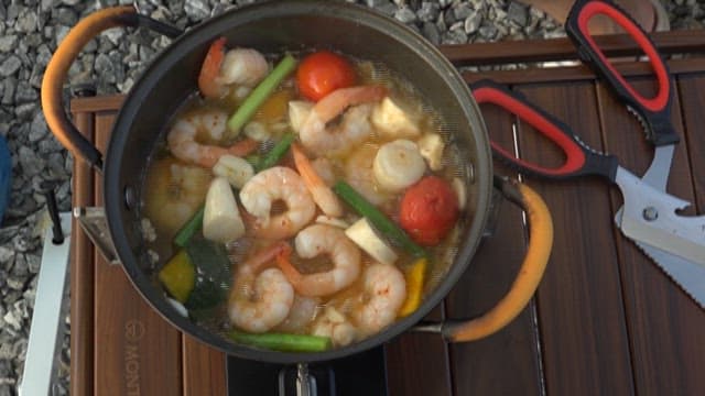 Stew with shrimp and fresh vegetables in a pot