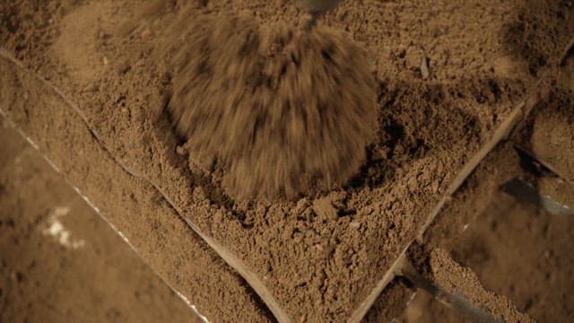 Scene of soil being compacted with a machine