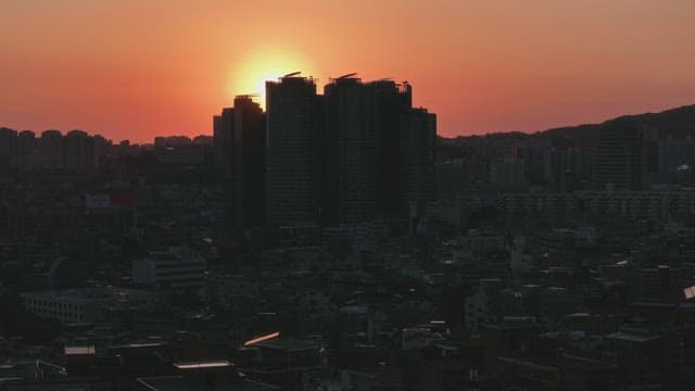 Sunset over a city skyline