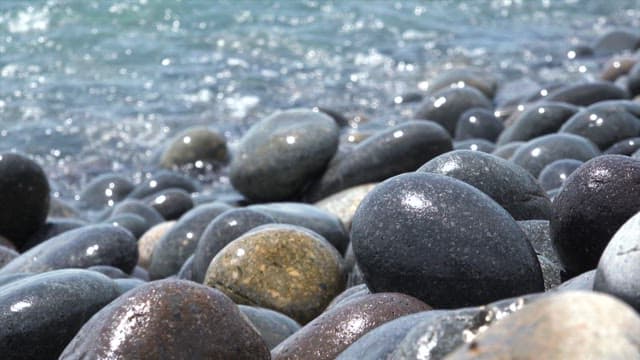 Close-up of Wet Pebbles by the Sea
