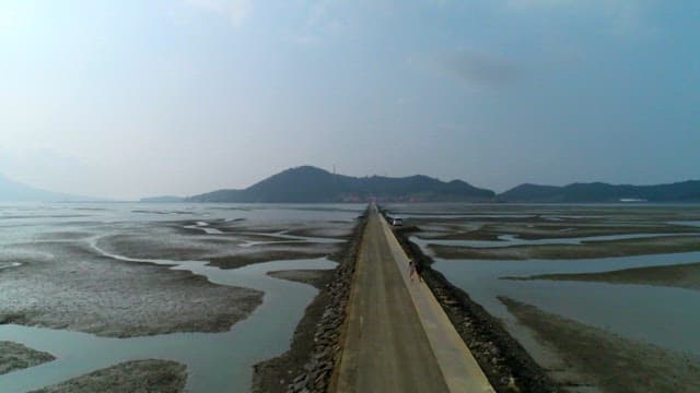 Sea road between the tidal flats of Shinan with tourists