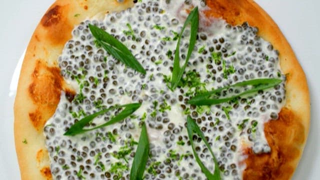 Gourmet Pizza with Caviar Sauce and Greens