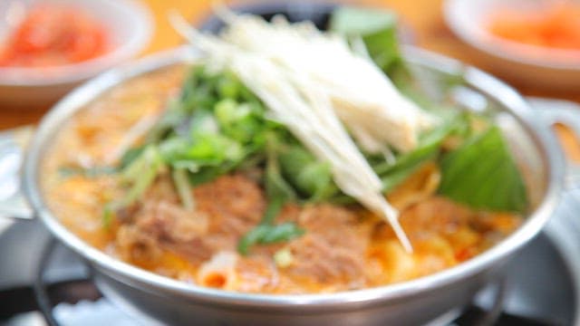 Back Bone Stew Boiling in a Metal Pot