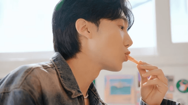 Young man enjoying a meal indoors